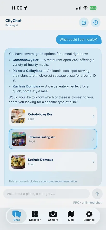 CityChat chat screen — asking what to eat nearby in Przemyśl, with suggested places